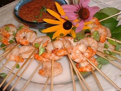 Platter of skewered shrimp with spicy Asian BBQ sauce
